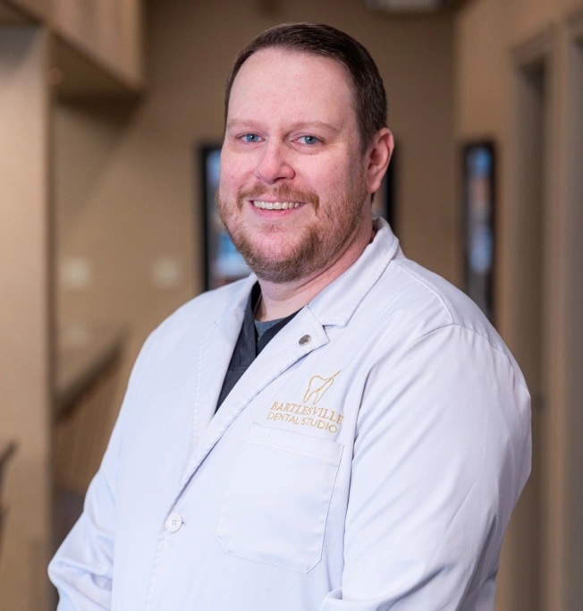 Dr. Andrew M. Noble, dentist at Bartlesville Dental Studio, smiling in professional portrait.