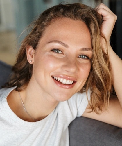 Smiling woman with healthy teeth representing quality dental care in Bartlesville.